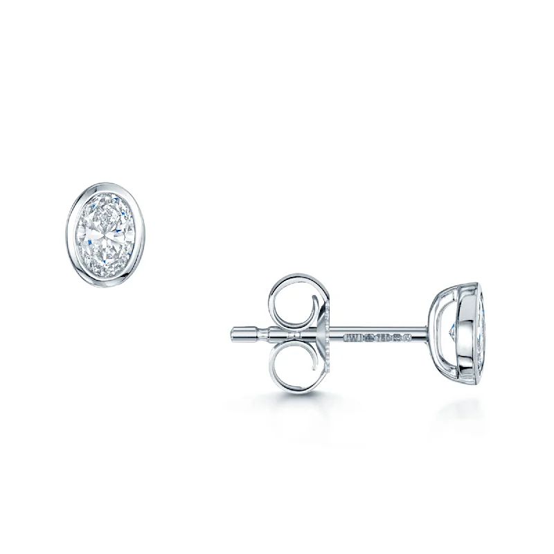 Bridal Earrings For Fashionable Brides-18ct White Gold Oval Cut Diamond 0.30ct Rub Over Stud Earrings